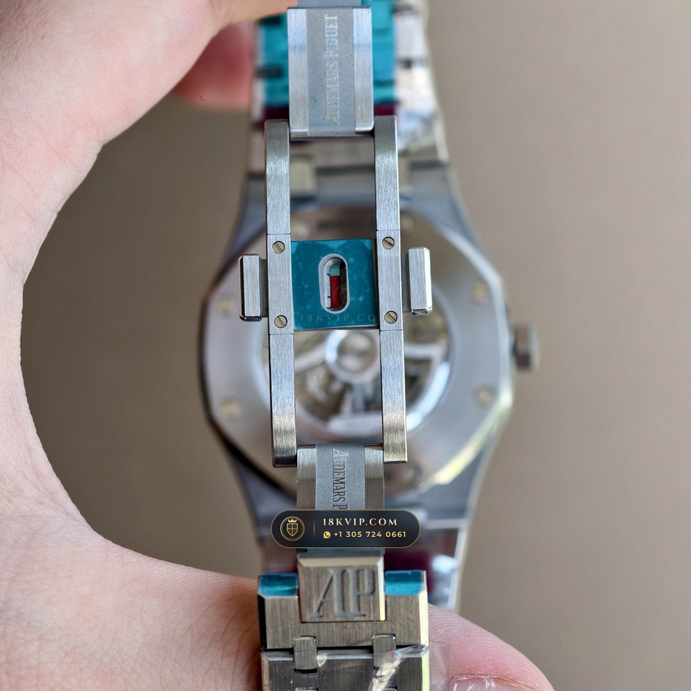 Audemars Piguet Royal Oak Double Balance Wheel Openworked 41mm Baguette Blue Topaz Bezel 18K White Gold Ref. 15412BC.TO.1220BC.01 — Private Vault Edition — Studio Angle 16 in 18K White Gold Au750 (224.8g Verified Mass, Audemars Piguet Cal. 3132 Dual-Balance Openworked)