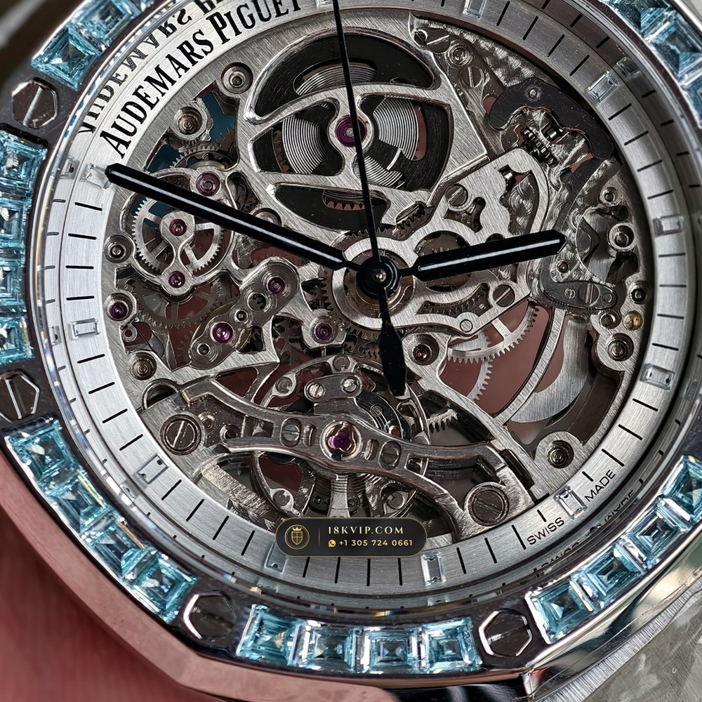 Audemars Piguet Royal Oak Double Balance Wheel Openworked 41mm Baguette Blue Topaz Bezel 18K White Gold Ref. 15412BC.TO.1220BC.01 — Private Vault Edition — Studio Angle 17 in 18K White Gold Au750 (224.8g Verified Mass, Audemars Piguet Cal. 3132 Dual-Balance Openworked)