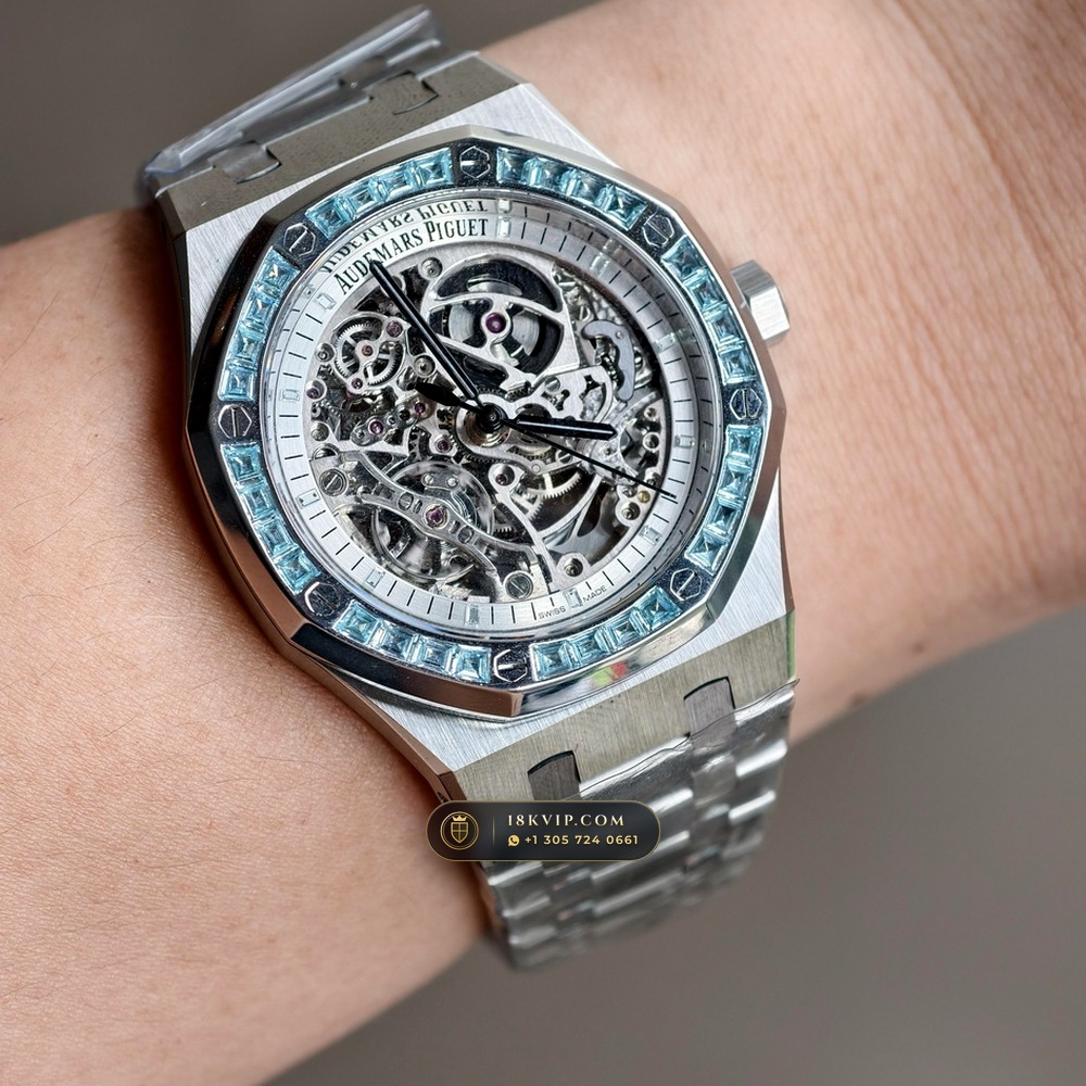 Audemars Piguet Royal Oak Double Balance Wheel Openworked 41mm Baguette Blue Topaz Bezel 18K White Gold Ref. 15412BC.TO.1220BC.01 — Private Vault Edition — Studio Angle 19 in 18K White Gold Au750 (224.8g Verified Mass, Audemars Piguet Cal. 3132 Dual-Balance Openworked)