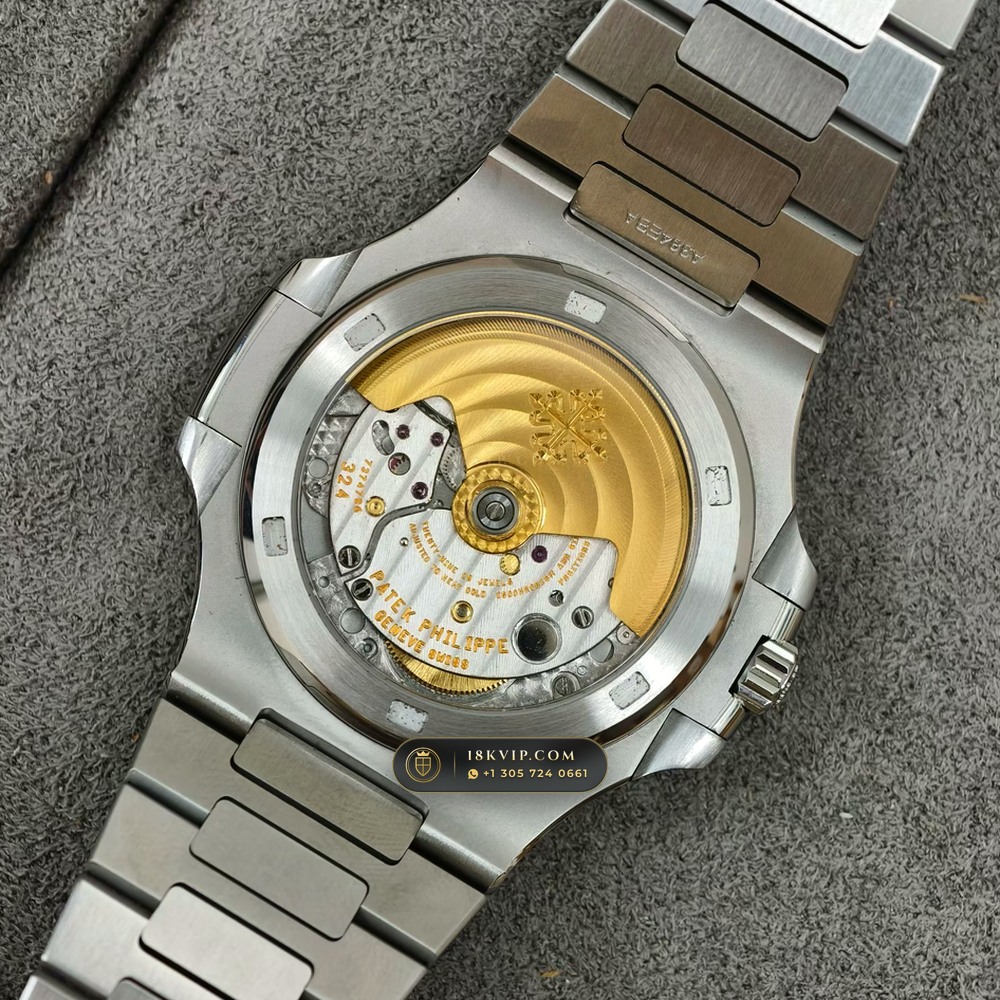 Patek Philippe Nautilus Self-Winding Baguette Ruby Bezel 950 Platinum Ref. 5711/112P-001 — Private Vault Edition — Studio Gallery Plate VIII in 950 Platinum Pt950 (245.1g Verified Mass, Patek Philippe Cal. 26-330 S C / Cal. 324 S C - 21K Gold Rotor)
