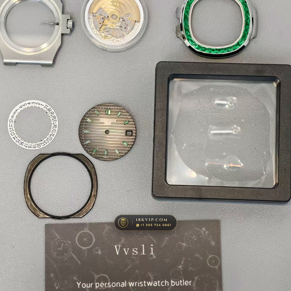 Patek Philippe Nautilus Self-Winding Baguette Emerald Bezel 950 Platinum 22K Gold Rotor Ref. 5711/113P-001 — Private Vault Edition — Studio Gallery Plate VIII in 950 Platinum Pt950 (244.9g Verified Mass, Patek Philippe Cal. 26-330 S C / Cal. 324 S C - 21K Gold Rotor)